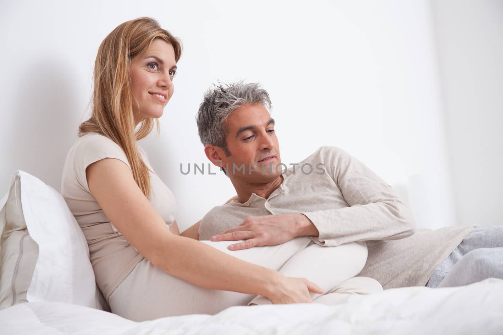 25-30, adult, apartment, attractive, bed, bedroom, caucasian, Couple, fun, handsome, happy, home, horizontal, house, leisure, lifestyle, love, marriage, men, model, nightwear, old, people, person, property, releases, sitting, sleep, smile, two, women, years, young