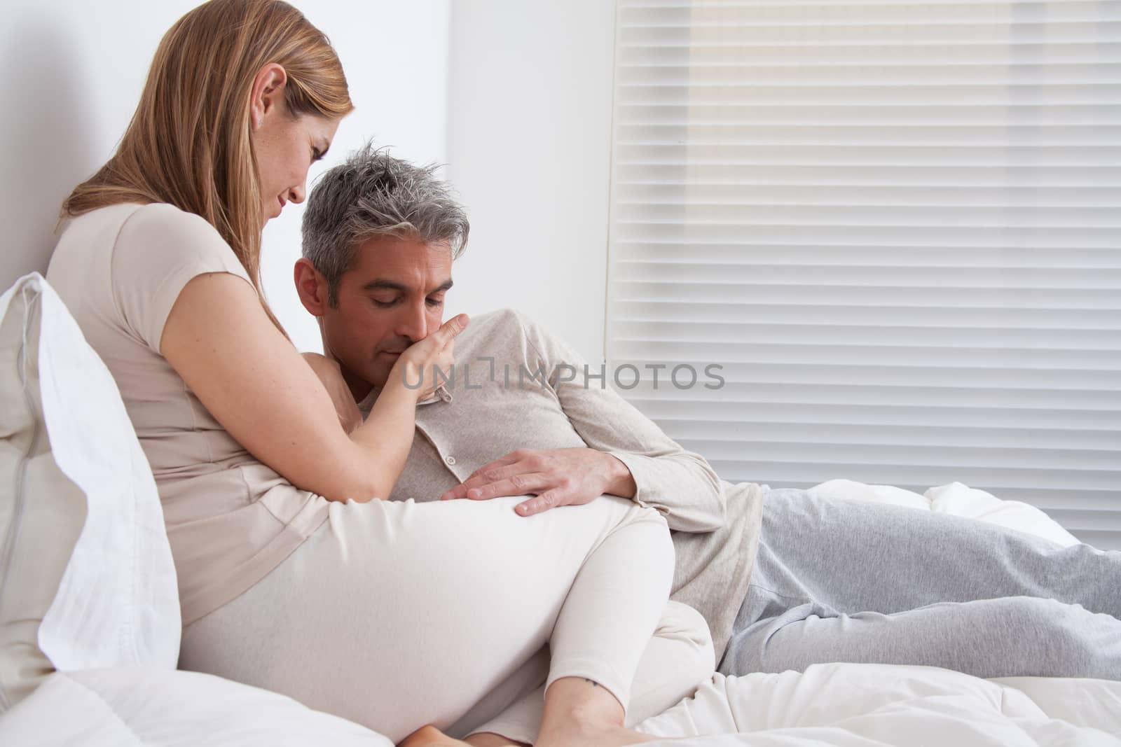 25-30, adult, apartment, attractive, bed, bedroom, caucasian, Couple, fun, handsome, happy, home, horizontal, house, leisure, lifestyle, love, marriage, men, model, nightwear, old, people, person, property, releases, sitting, smile, two, women, years, young