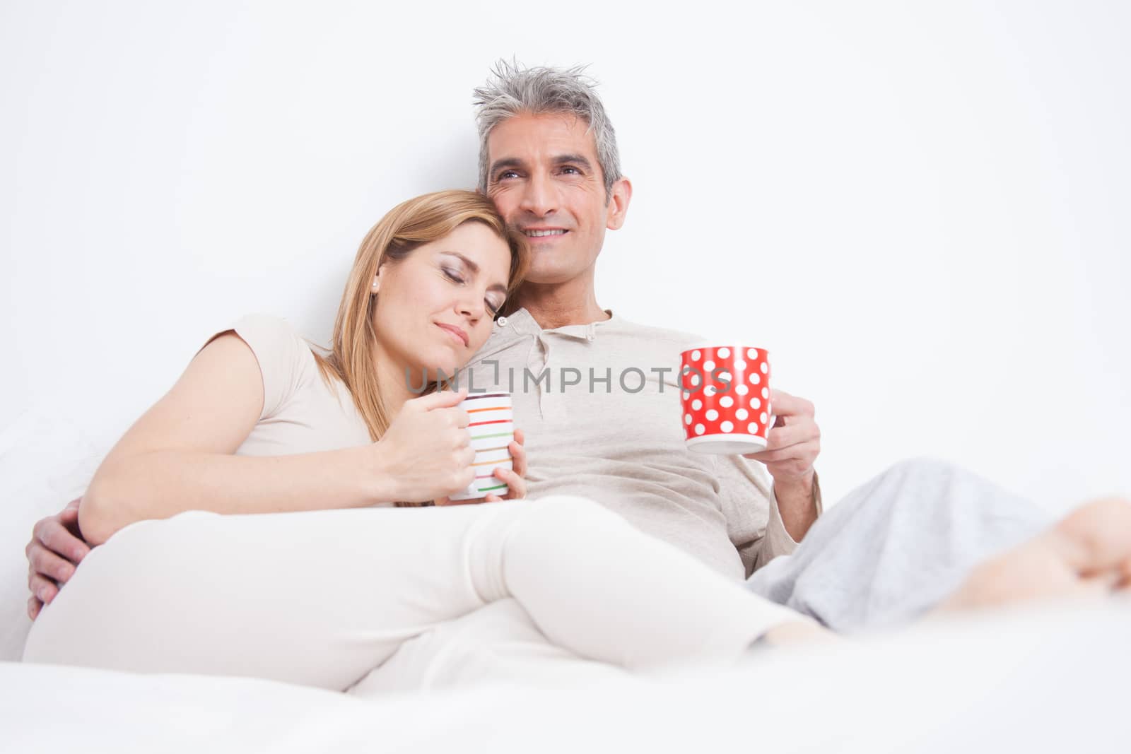 25-30, adult, apartment, attractive, bed, bedroom, caucasian, coffee, Couple, fun, handsome, happy, home, horizontal, house, leisure, lifestyle, love, marriage, men, model, nightwear, old, people, person, property, releases, sitting, smile, tea, two, women, years, young