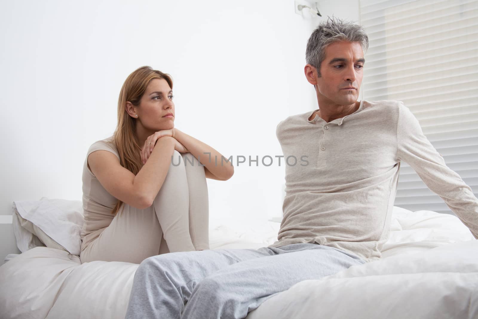 25-30, adult, apartment, attractive, bed, bedroom, caucasian, Couple, depression, fun, handsome, happy, home, horizontal, house, leisure, lifestyle, love, marriage, men, model, nightwear, old, people, person, property, releases, sitting, two, women, years, young