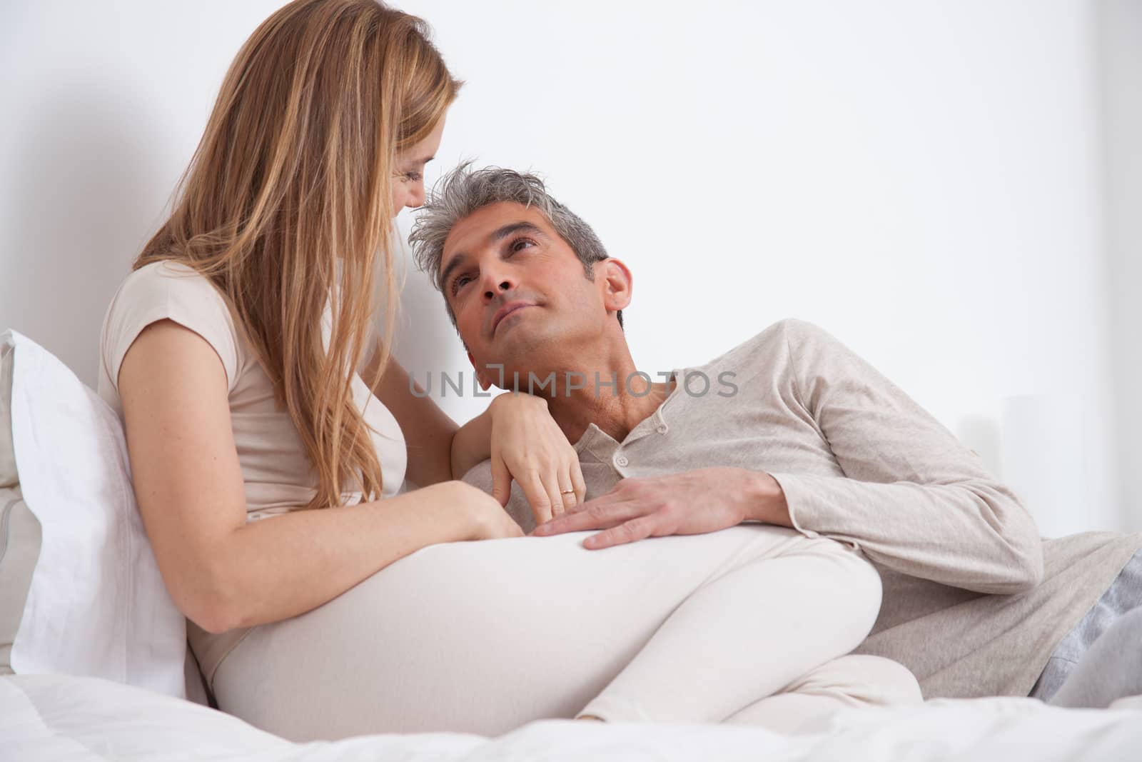 25-30, adult, apartment, attractive, bed, bedroom, caucasian, Couple, fun, handsome, happy, home, horizontal, house, leisure, lifestyle, love, marriage, men, model, nightwear, old, people, person, property, releases, sitting, smile, two, women, years, young