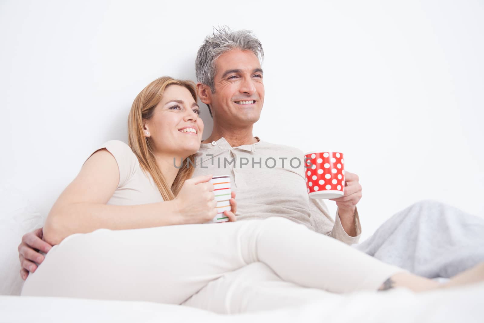 25-30, adult, apartment, attractive, bed, bedroom, caucasian, coffee, Couple, fun, handsome, happy, home, horizontal, house, leisure, lifestyle, love, marriage, men, model, nightwear, old, people, person, property, releases, sitting, smile, tea, two, women, years, young