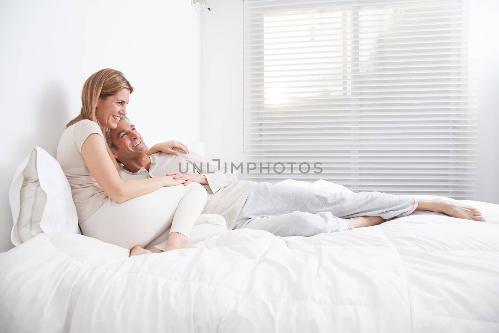 25-30, adult, apartment, attractive, bed, bedroom, caucasian, Couple, fun, handsome, happy, home, horizontal, house, leisure, lifestyle, love, marriage, men, model, nightwear, old, people, person, property, releases, sitting, sleep, smile, two, women, years, young