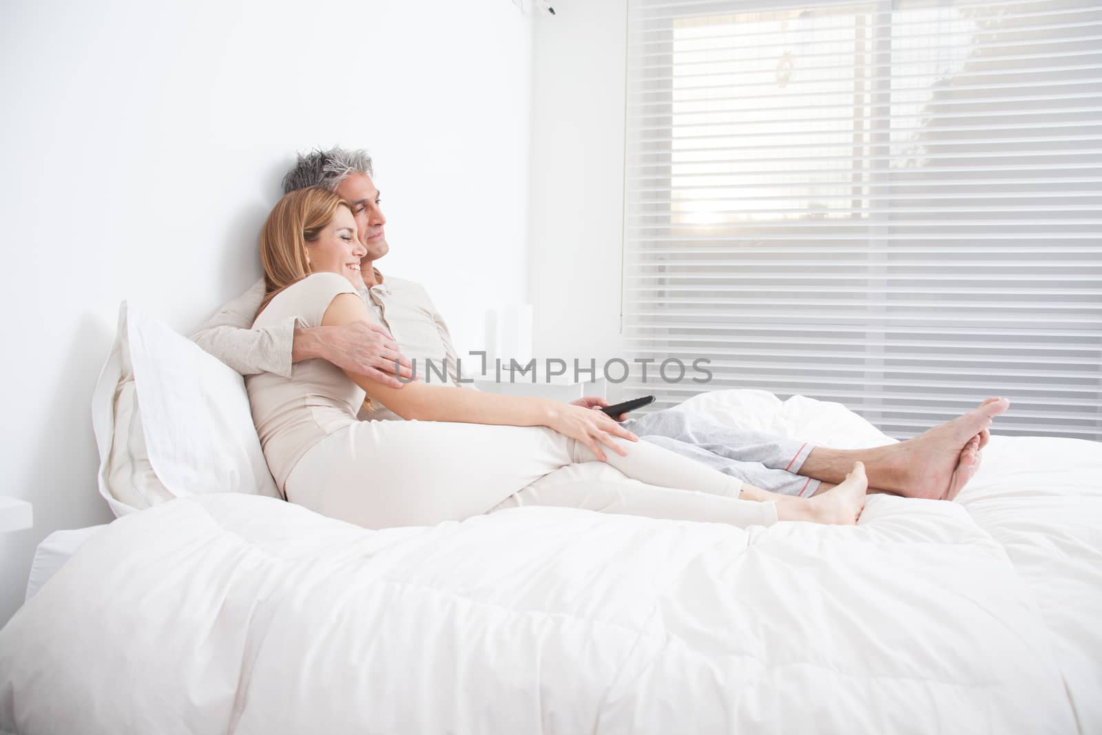25-30, adult, apartment, attractive, bed, bedroom, caucasian, Couple, fun, handsome, happy, home, horizontal, house, leisure, lifestyle, love, marriage, men, model, nightwear, old, pc, people, person, property, releases, sitting, smile, tablet, two, women, years, young