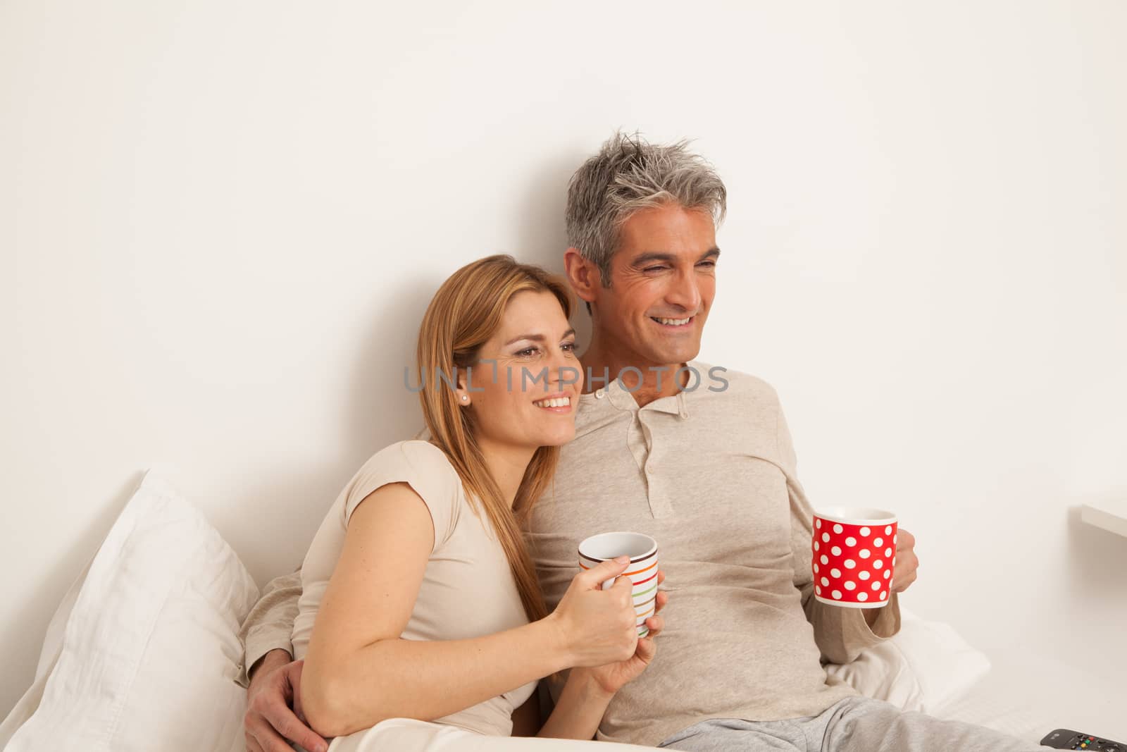 25-30, adult, apartment, attractive, bed, bedroom, caucasian, coffee, Couple, fun, handsome, happy, home, horizontal, house, leisure, lifestyle, love, marriage, men, model, nightwear, old, people, person, property, releases, sitting, smile, tea, two, women, years, young