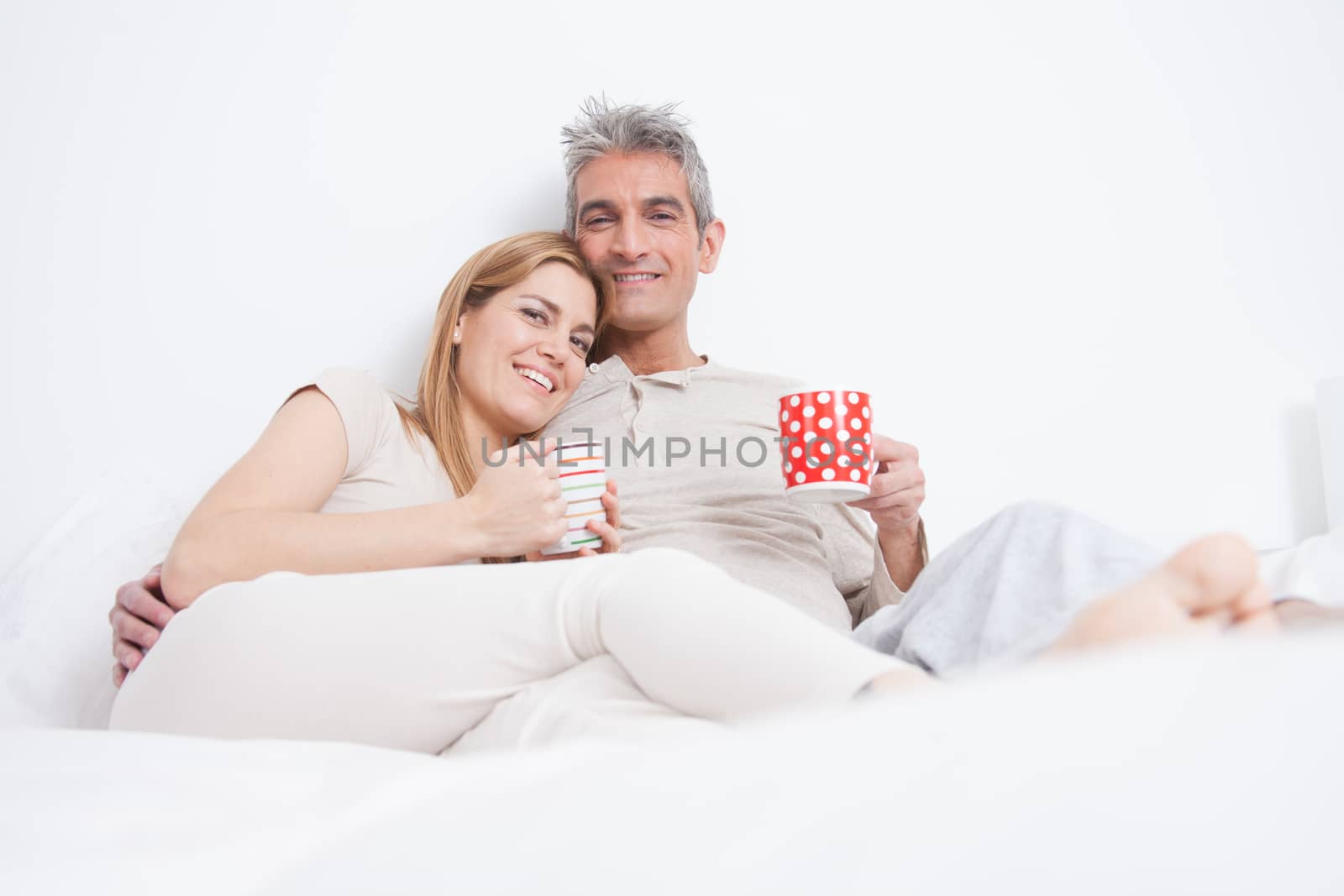 25-30, adult, apartment, attractive, bed, bedroom, caucasian, coffee, Couple, fun, handsome, happy, home, horizontal, house, leisure, lifestyle, love, marriage, men, model, nightwear, old, people, person, property, releases, sitting, smile, tea, two, women, years, young