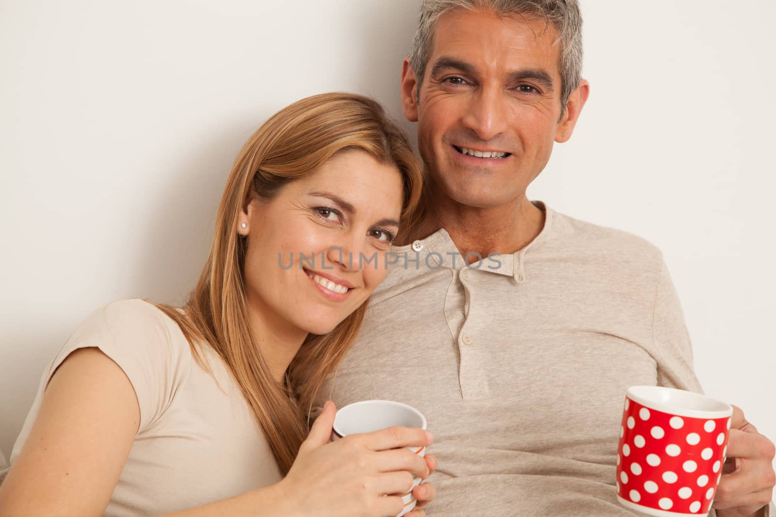 25-30, adult, apartment, attractive, bed, bedroom, caucasian, coffee, Couple, fun, handsome, happy, home, horizontal, house, leisure, lifestyle, love, marriage, men, model, nightwear, old, people, person, property, releases, sitting, smile, tea, two, women, years, young