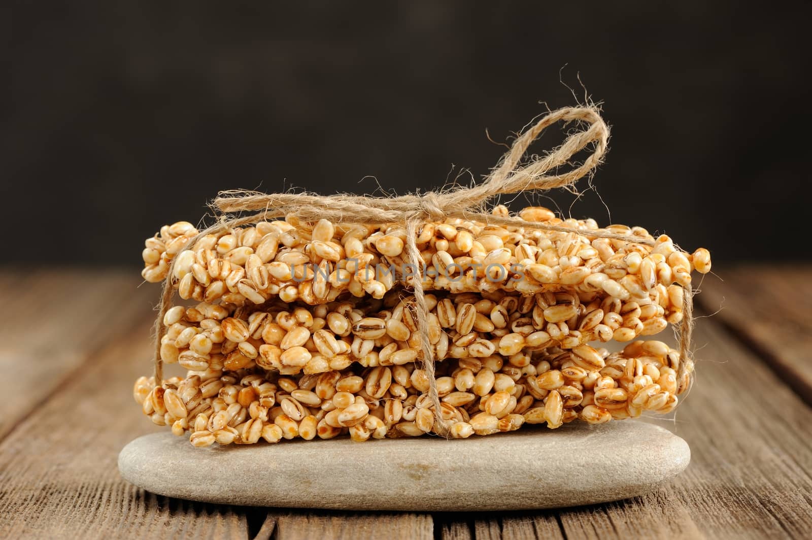 Barley granola bars in pile on rock closeup macro horizontal
