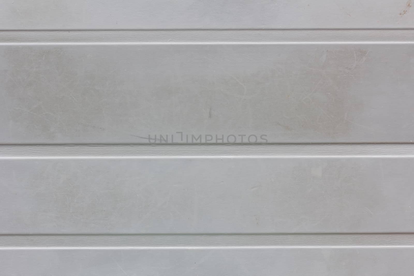 dirty gray wall background or texture with horizontal strips.