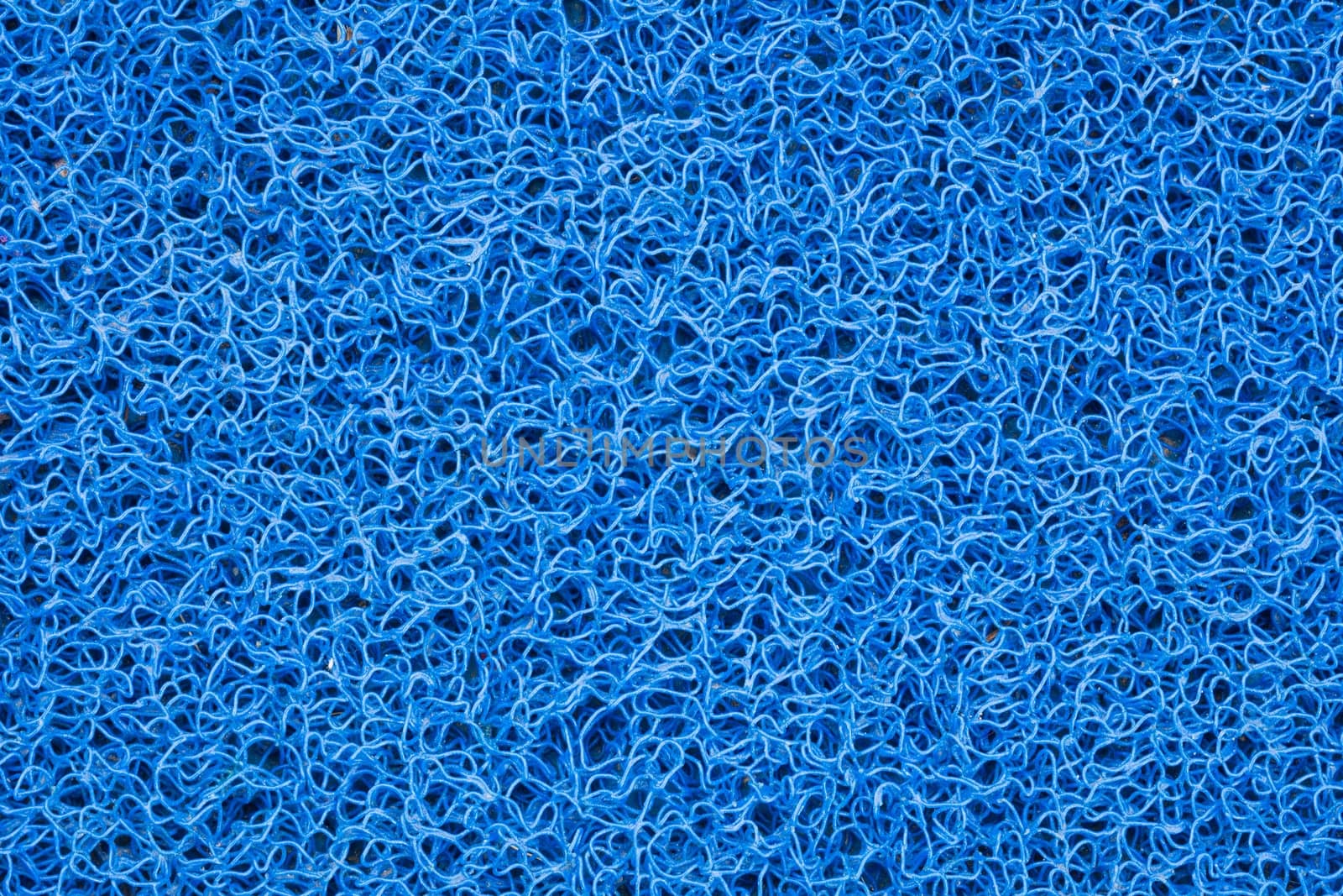 Background of green carpet or foot scraper or door mat texture.