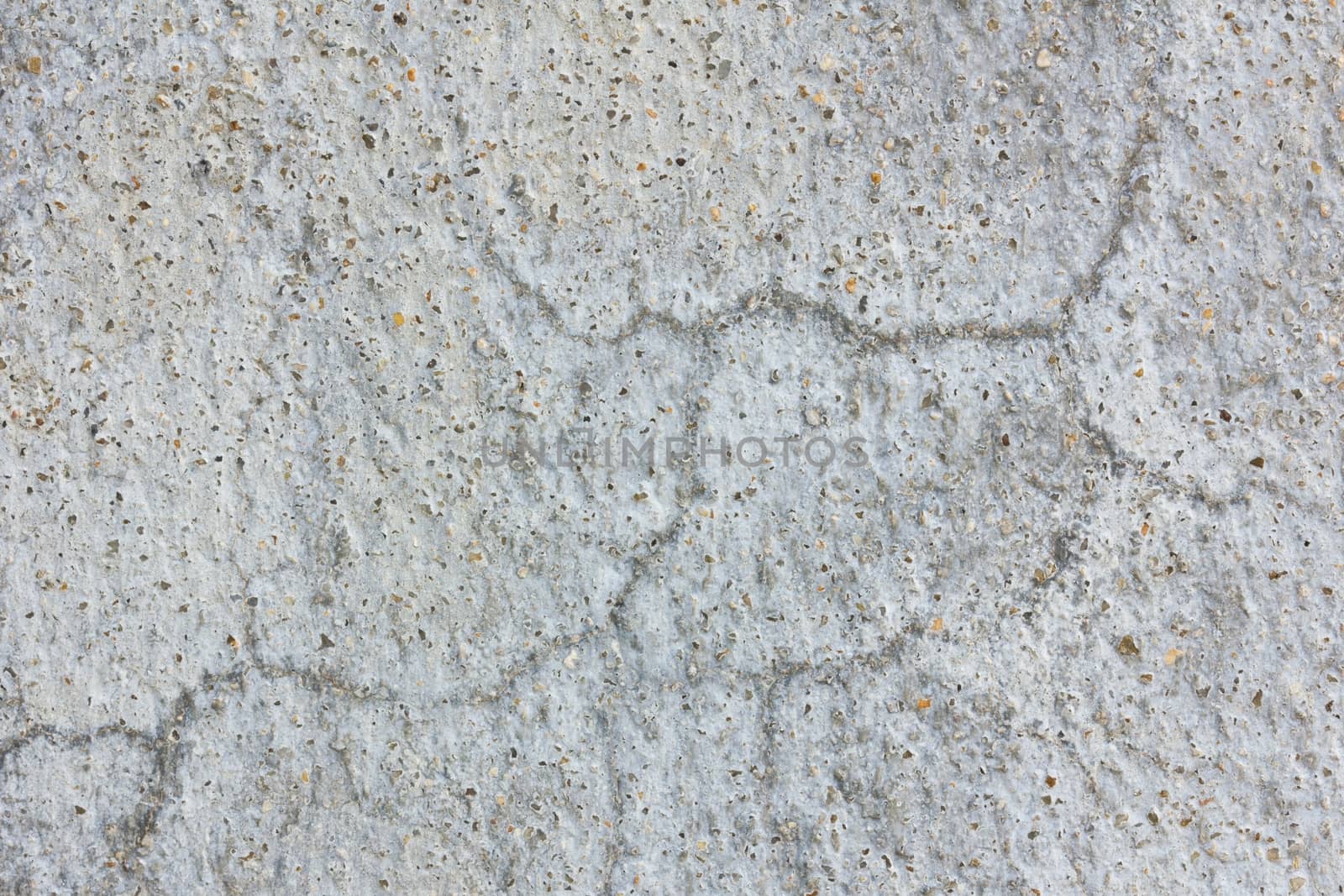 Old worn and cracked asphalt with cracks.