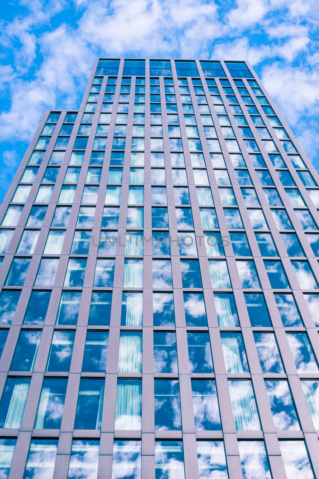 Skyscraper with sky reflection by Sportactive