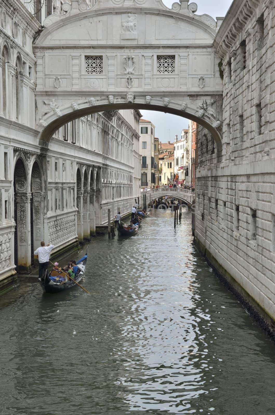 The Bridge of Sighs is a bridge located in Venice, Italy. The bridge name, given by Lord Byron in the 19th century, comes from the suggestion that prisoners would sigh at their final view of beautiful Venice through the window before being taken down to their cells. 

It connects the New Prison  to the interrogation rooms in the Doge Palace. It was designed by Antonio Contino  and was built in 1600.
