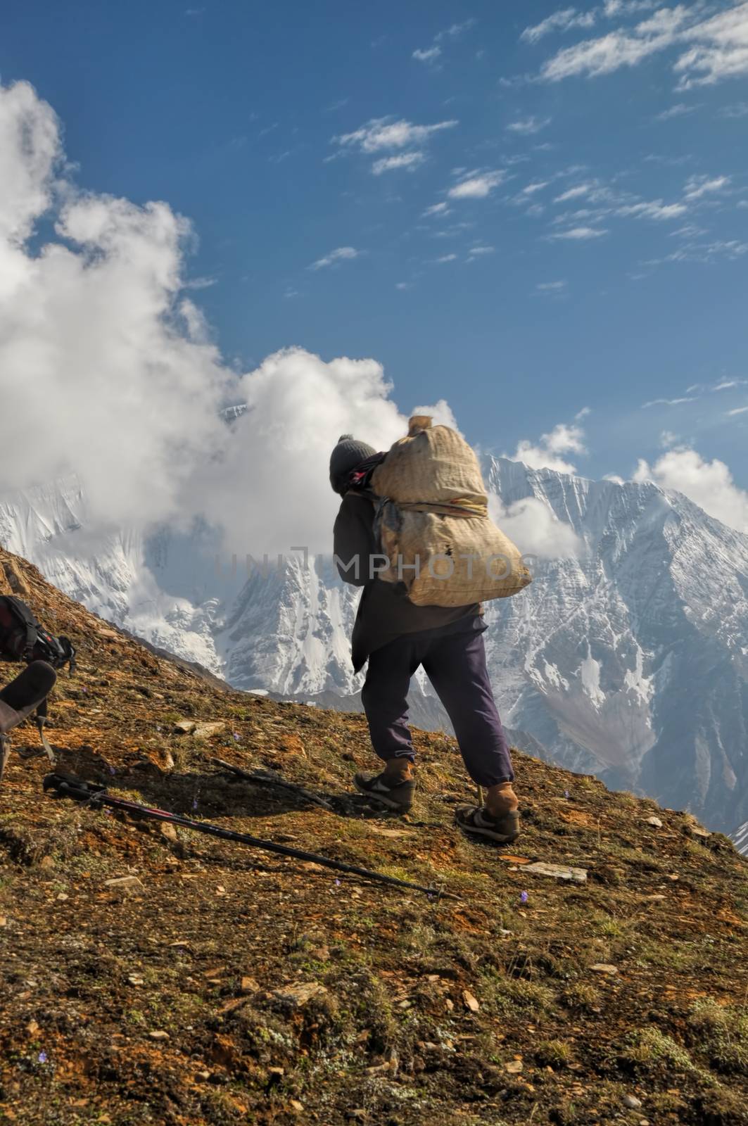 Sherpa in picturesque Himalayas mountains in Nepal