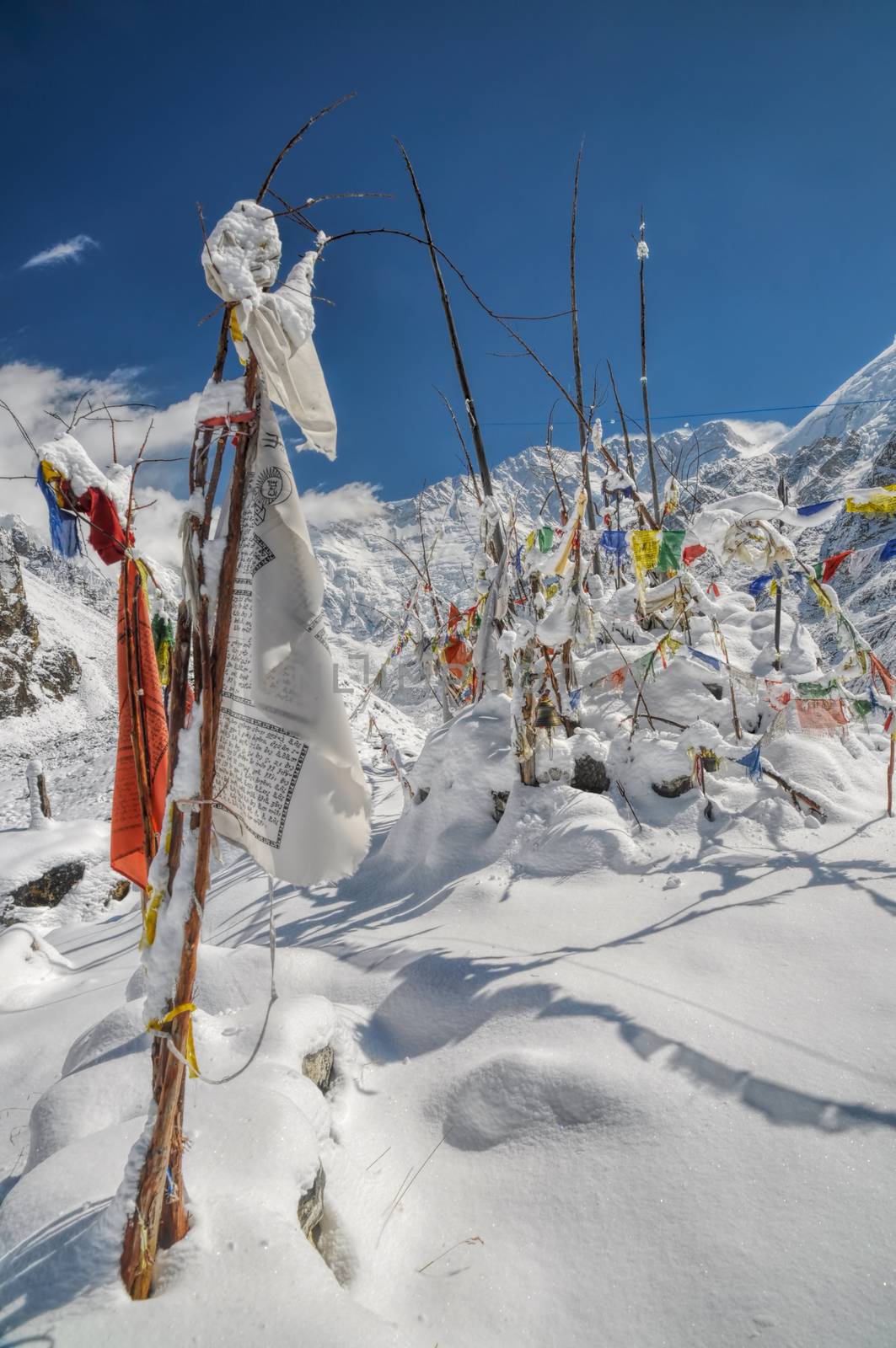Buddhist prayer flags in Himalayas near Kanchenjunga, the third tallest mountain in the world