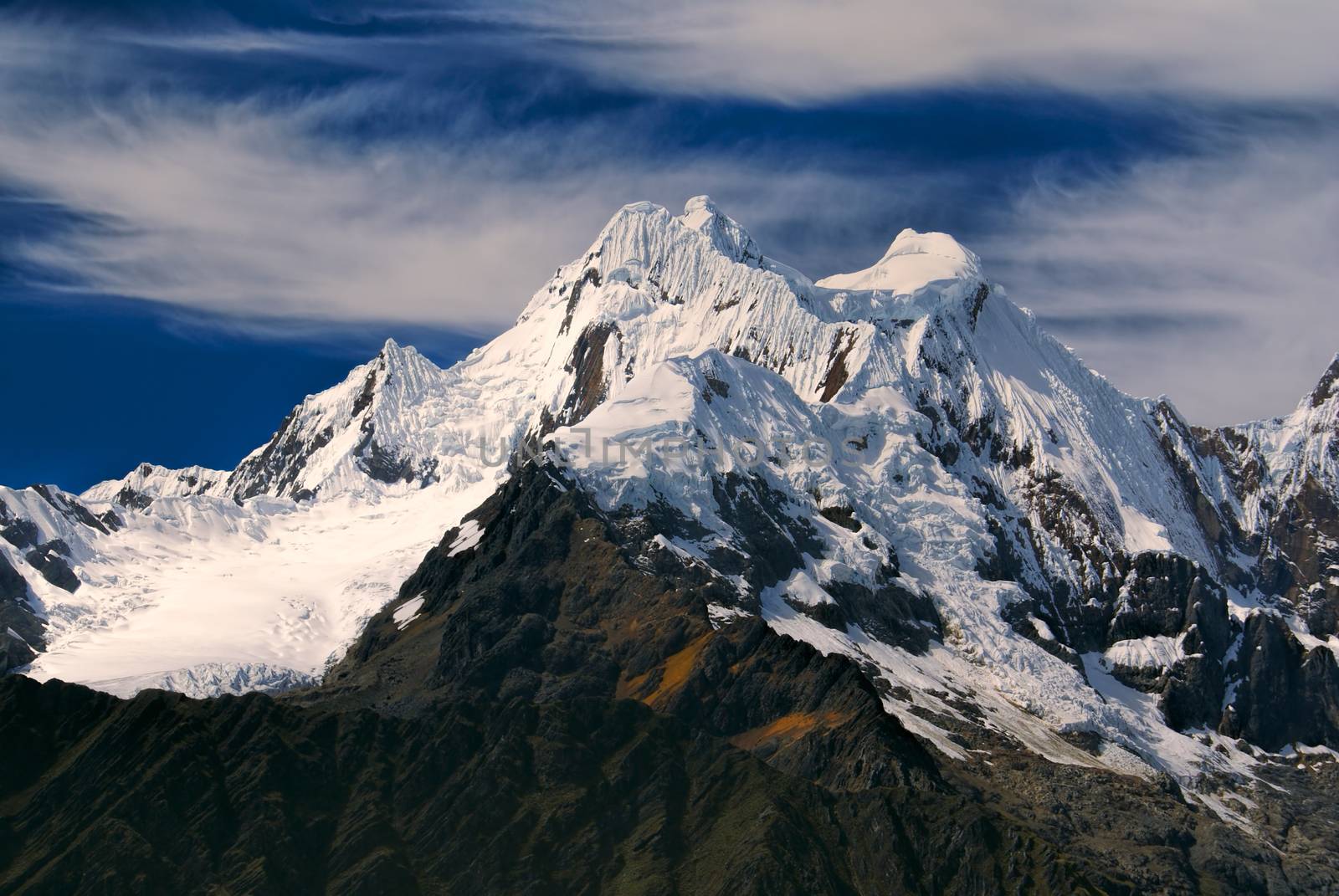 Majestic Alpamayo, one of highest mountain peaks in Peruvian Andes, Cordillera Blanca