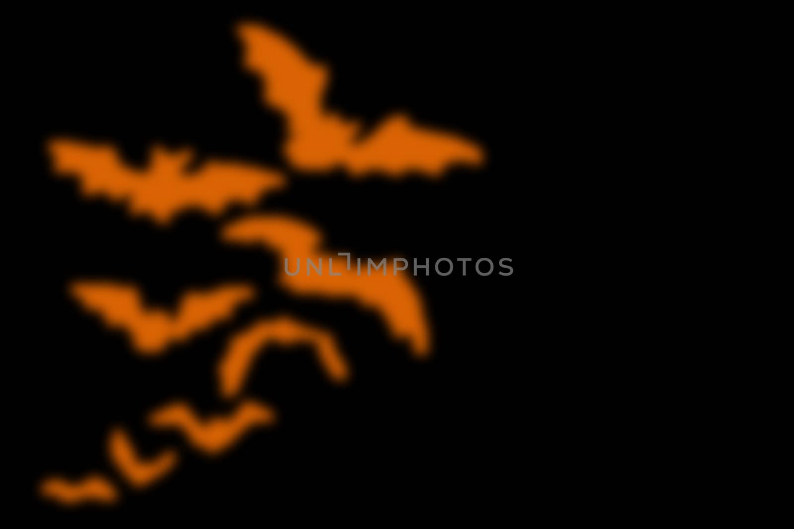 abstract black background with blurred orange line, for halloween. copyspace on the right