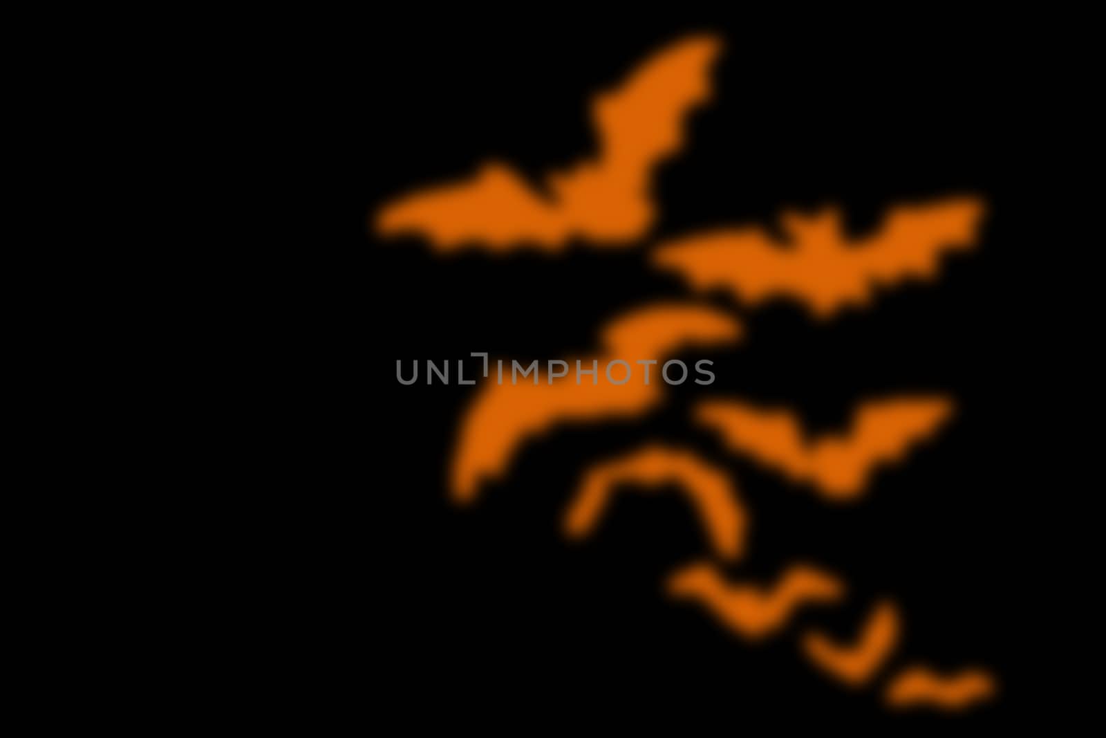 abstract black background with blurred orange line, for halloween. copyspace on the left