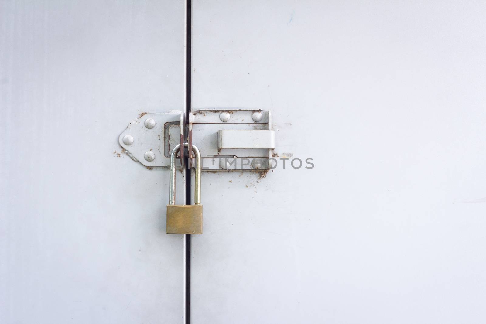 Closeup metal door with lock with copyspace on the right