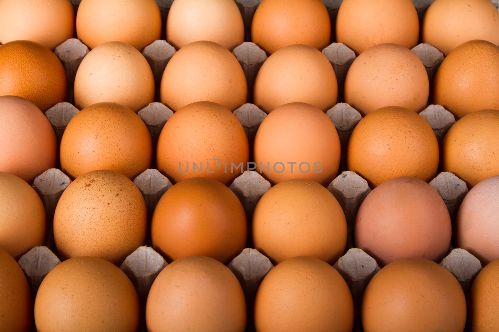 Brown chicken eggs in the package. Top view