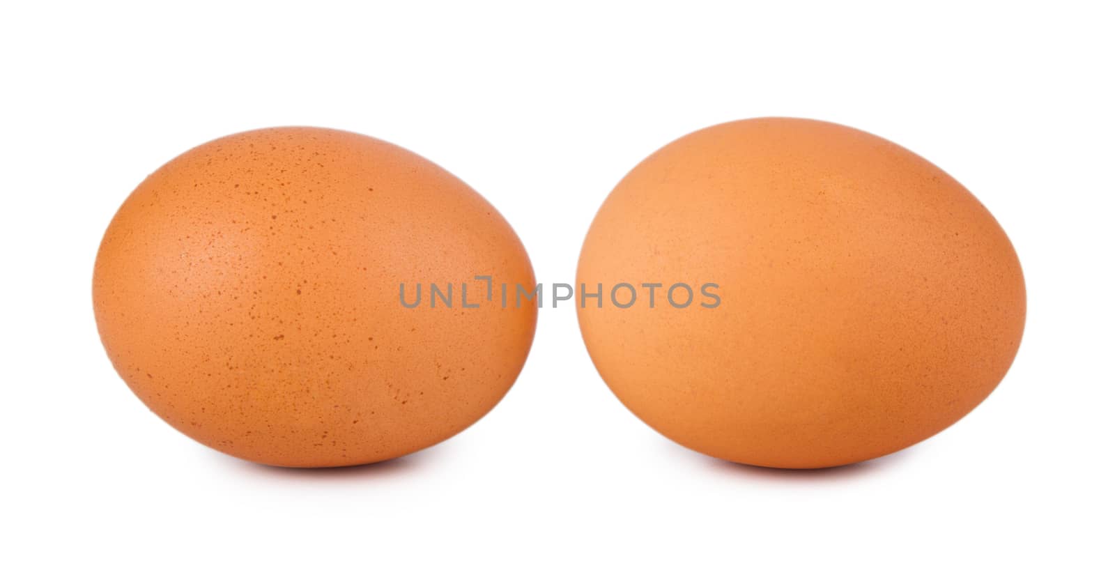 Two fresh brown eggs isolated on a white background