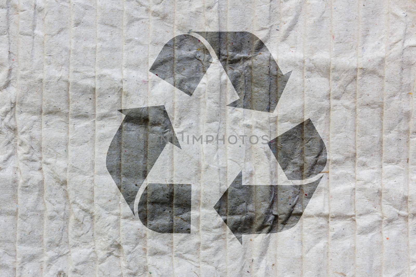 Recycle logo on old paper