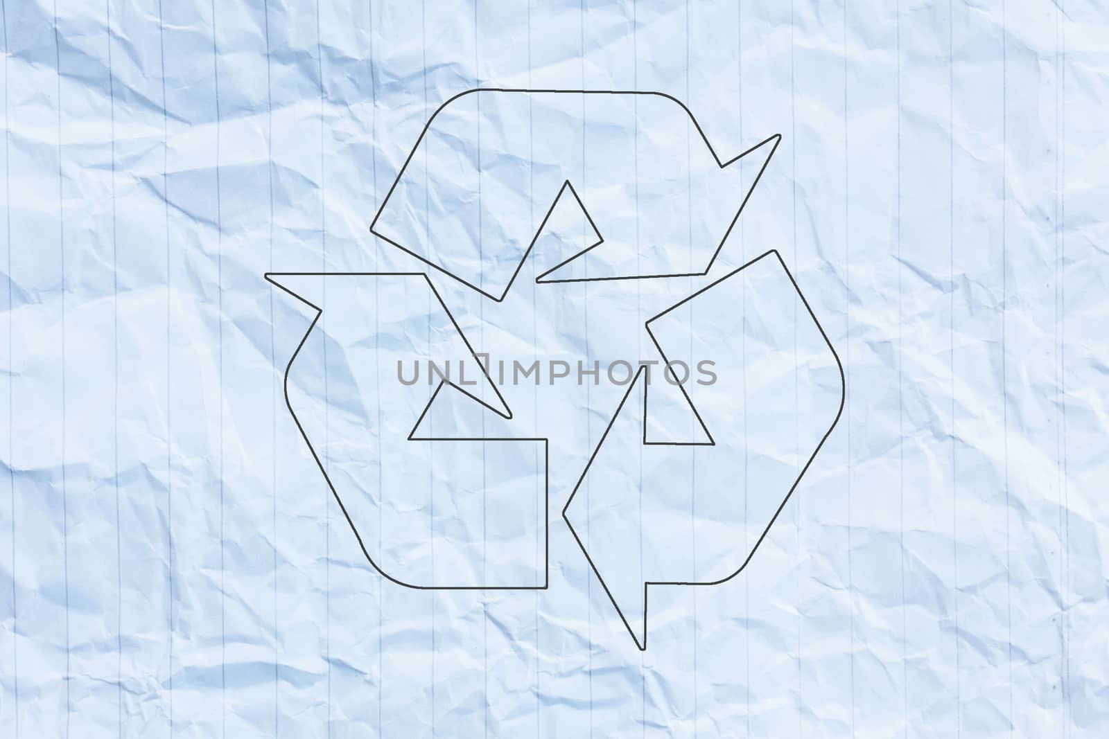 Recycle logo on crumpled paper.