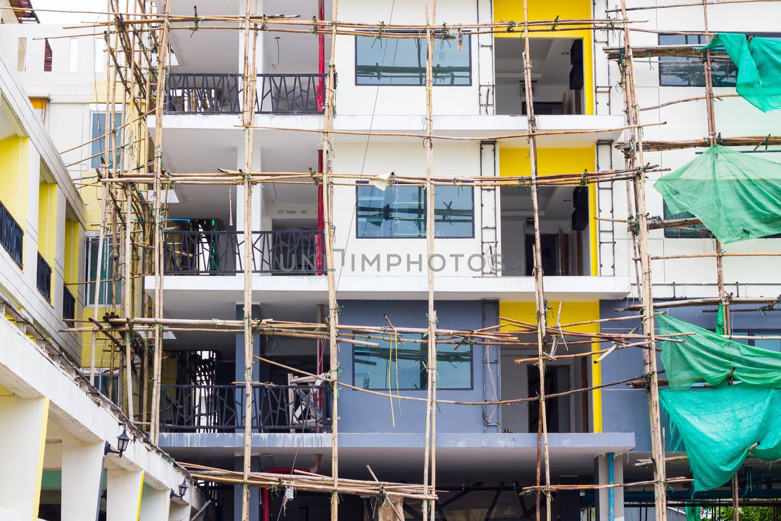 repairing old building and bamboo scaffolding.