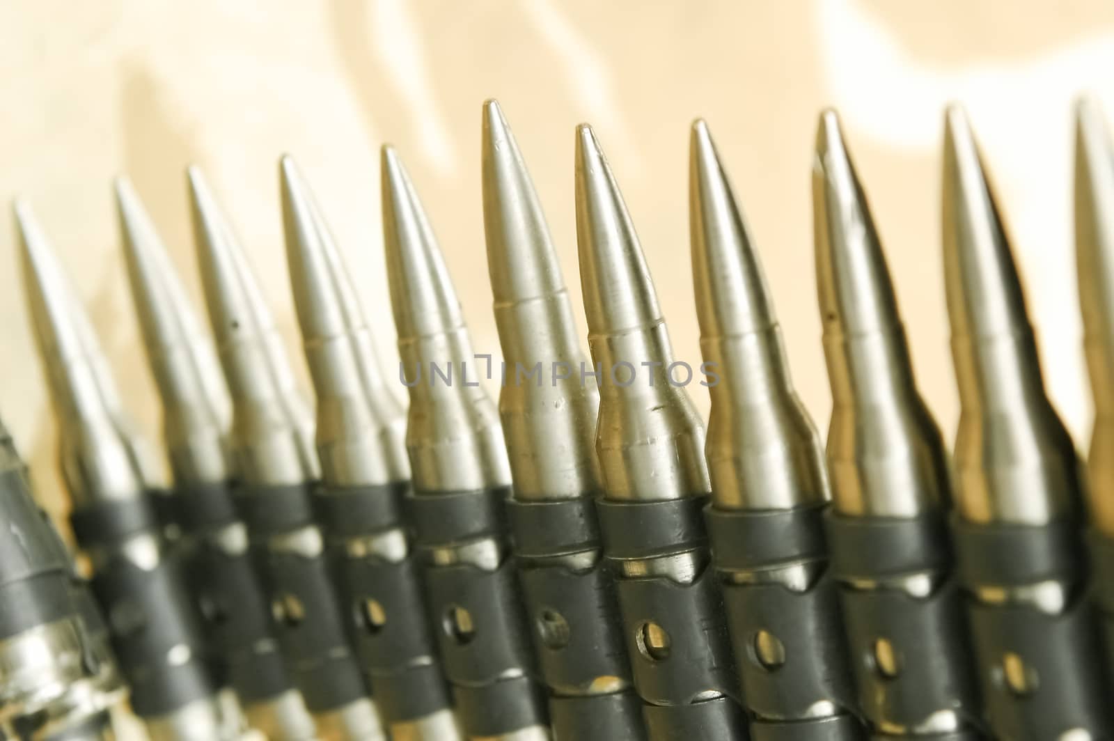 closeup of rifle bullets in an ammunition belt