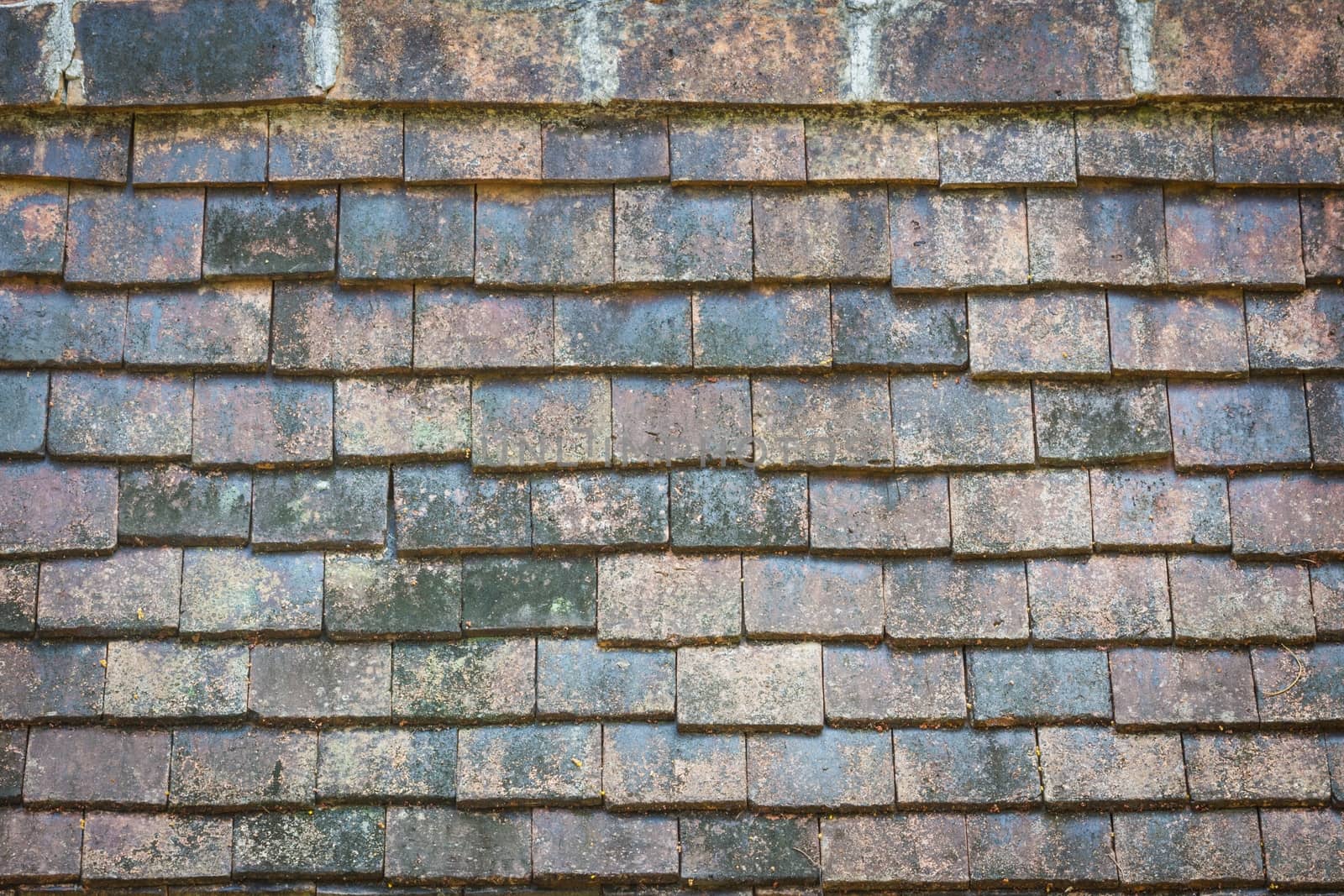 close-up old traditional roof tiles from baked clay.