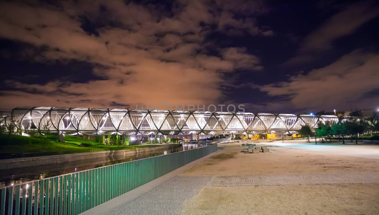 Madrid, Spain - May 5, 2012: Arganzuela Bridge illuminated on a spring night and Madrid Rio Park, Madrid, Spain