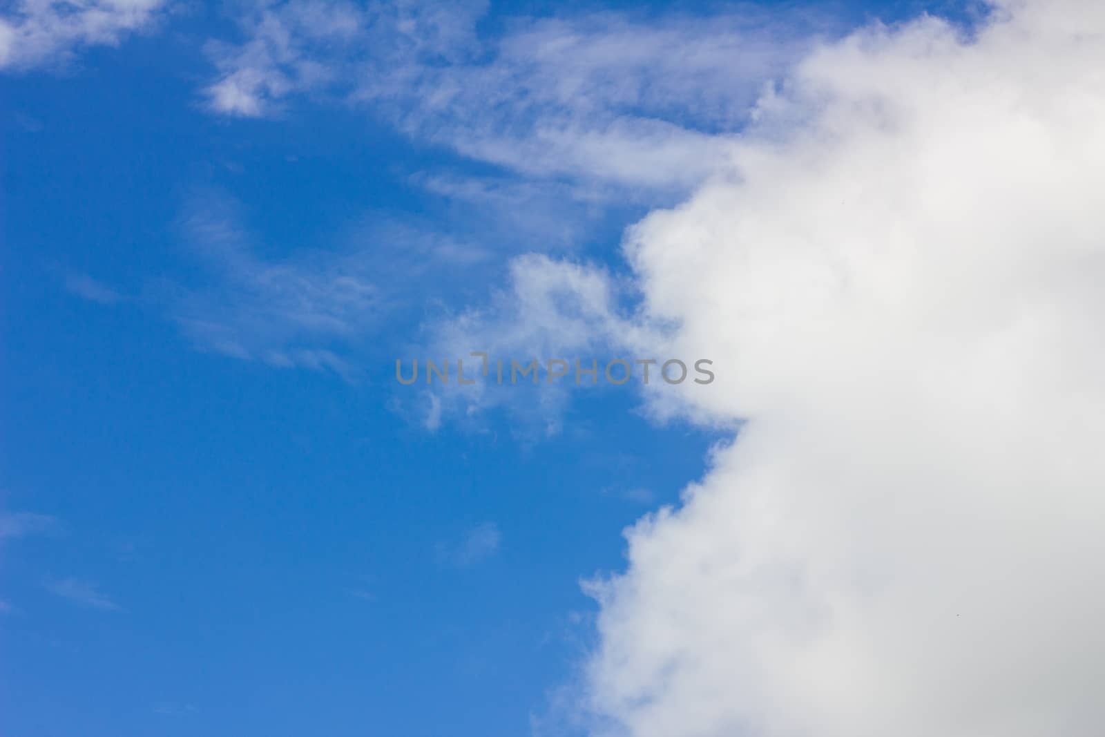 clouds like human smiling face in the wonderful blue sky used as background