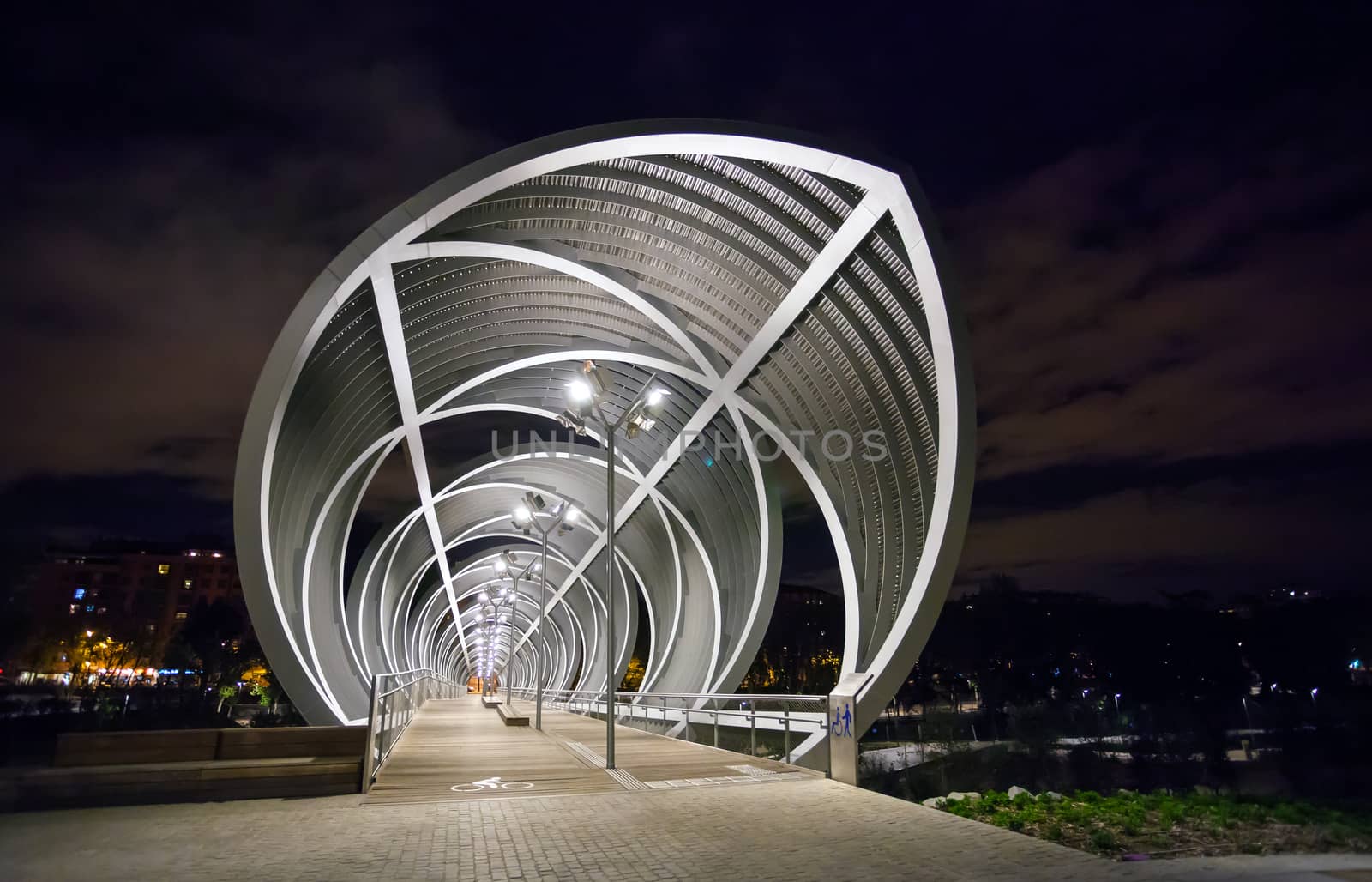 Madrid, Spain - May 5, 2012: Arganzuela Bridge illuminated on a spring night and Madrid Rio Park, Madrid, Spain