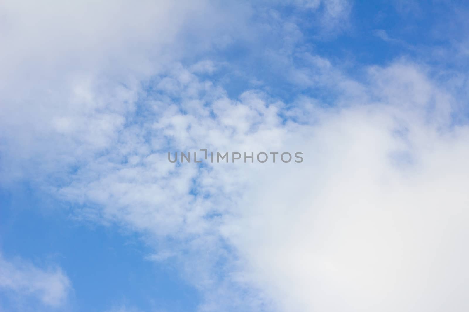 clouds in the wonderful blue sky used as background 