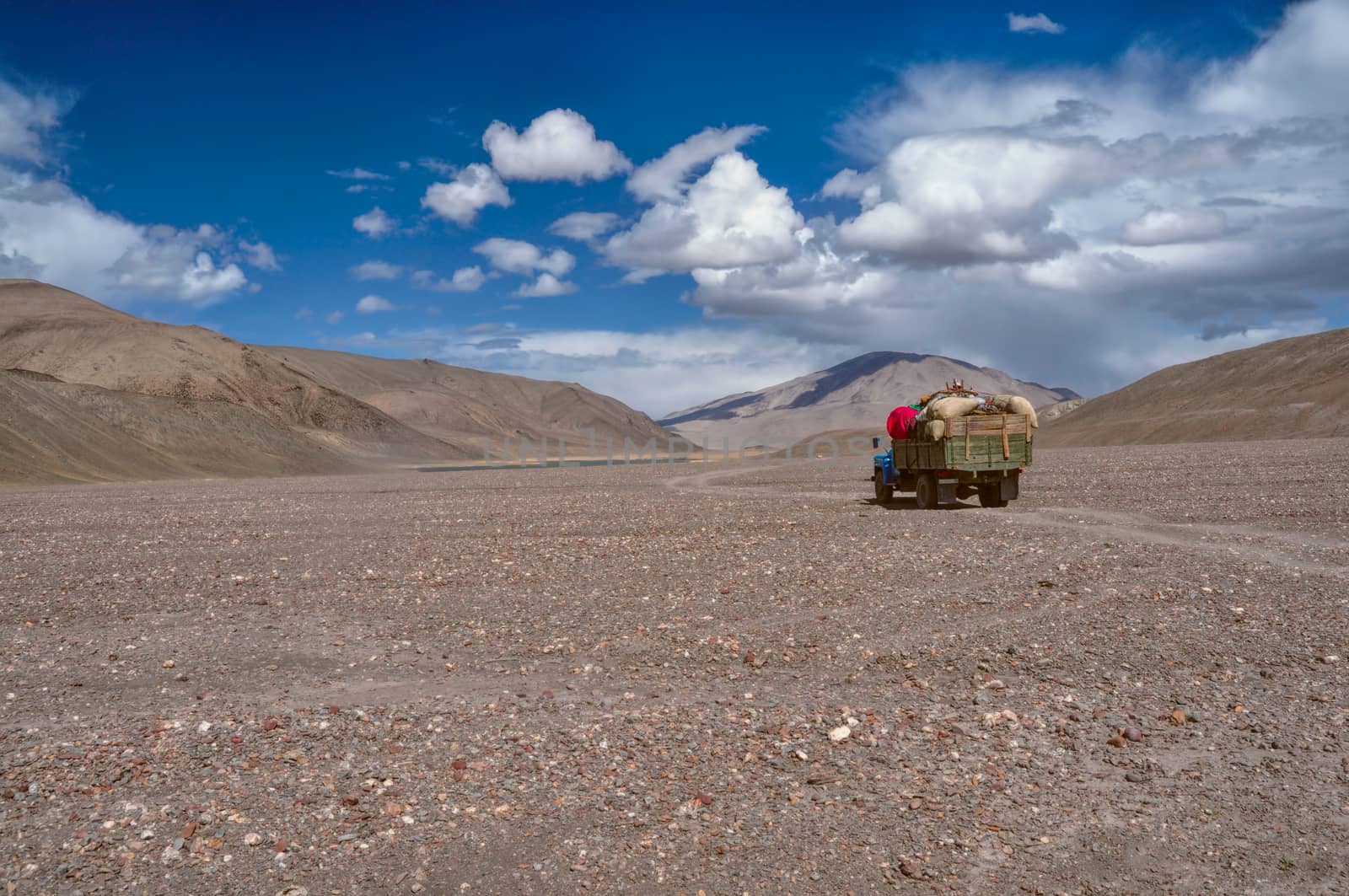 Truck loaded with goods on the road in Pamir mountains in Tajikistan