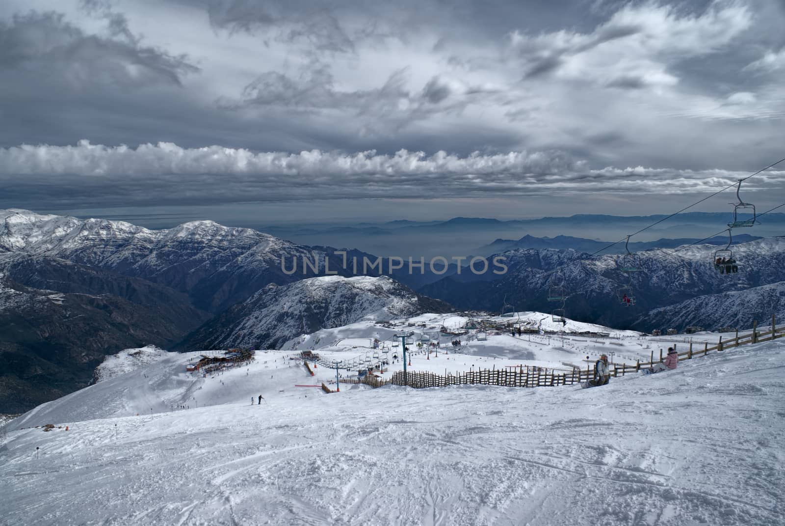 Picturesque view of piste in Valle Nevado under gloomy grey sky