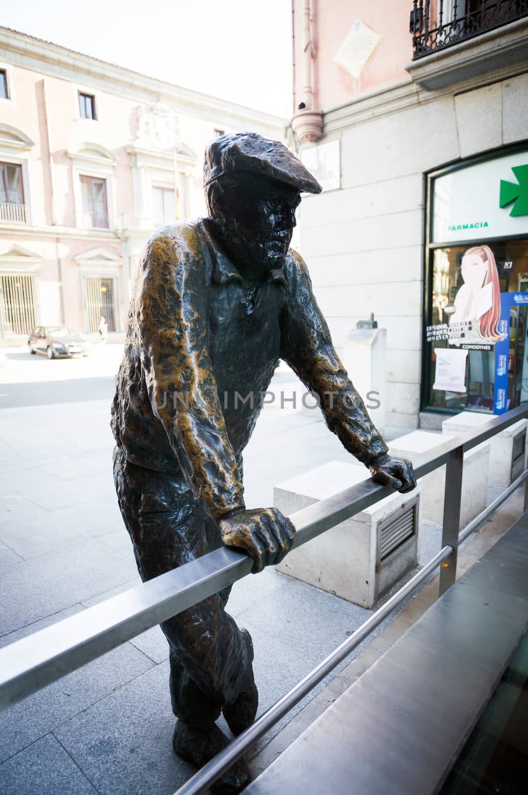 Madrid, Spain - May 9, 2012: Conteporan street sculpture of a person on Calle Almudena in Madrid, Spain