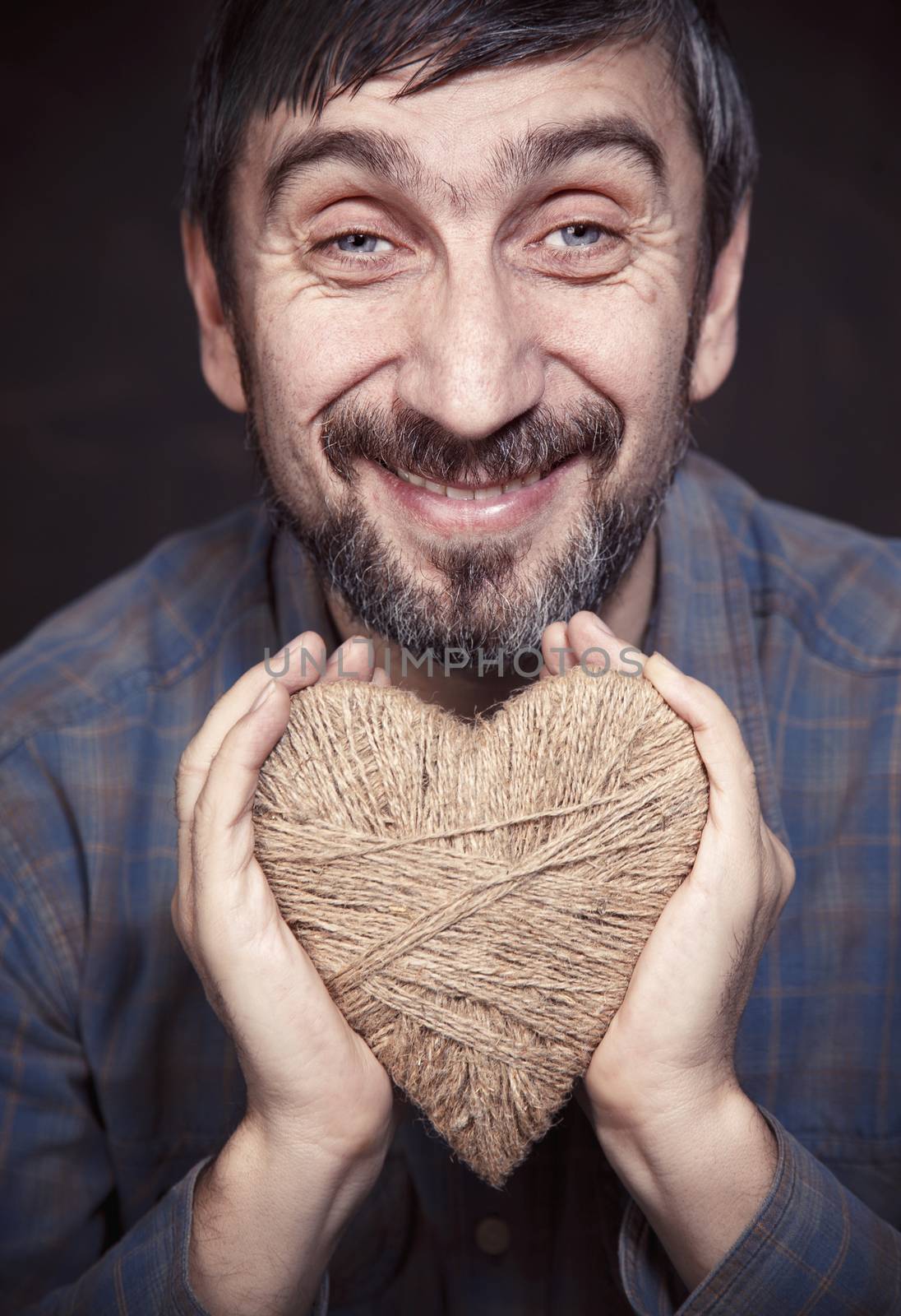 Man holding heart in his hands by anelina