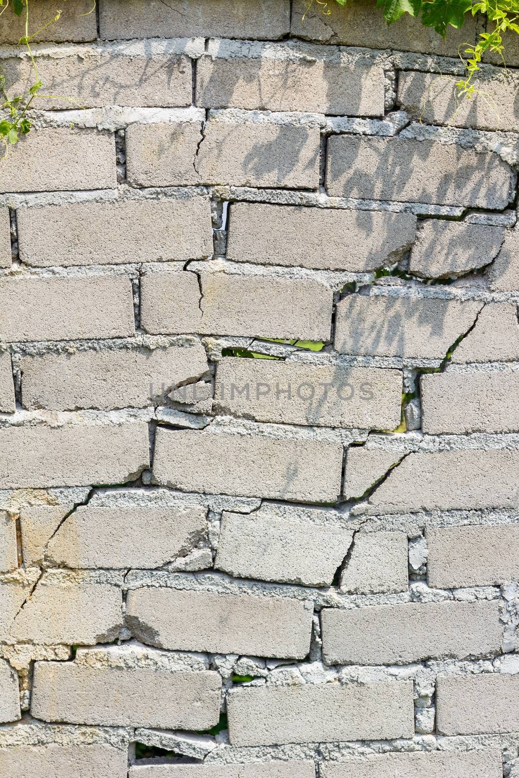 closeup of dangerous wall with cracks.