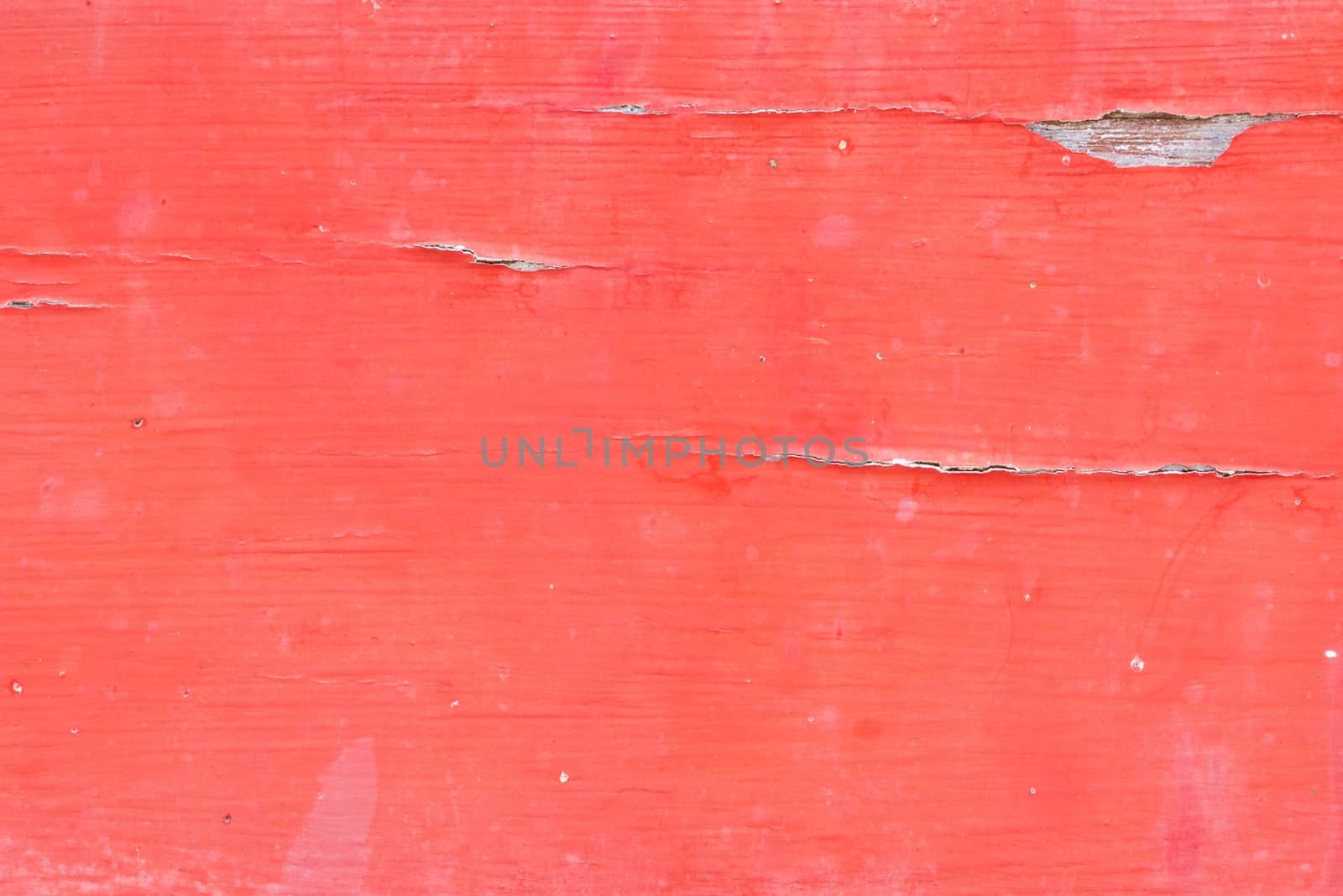closeup of old woodboard texture painted on red.