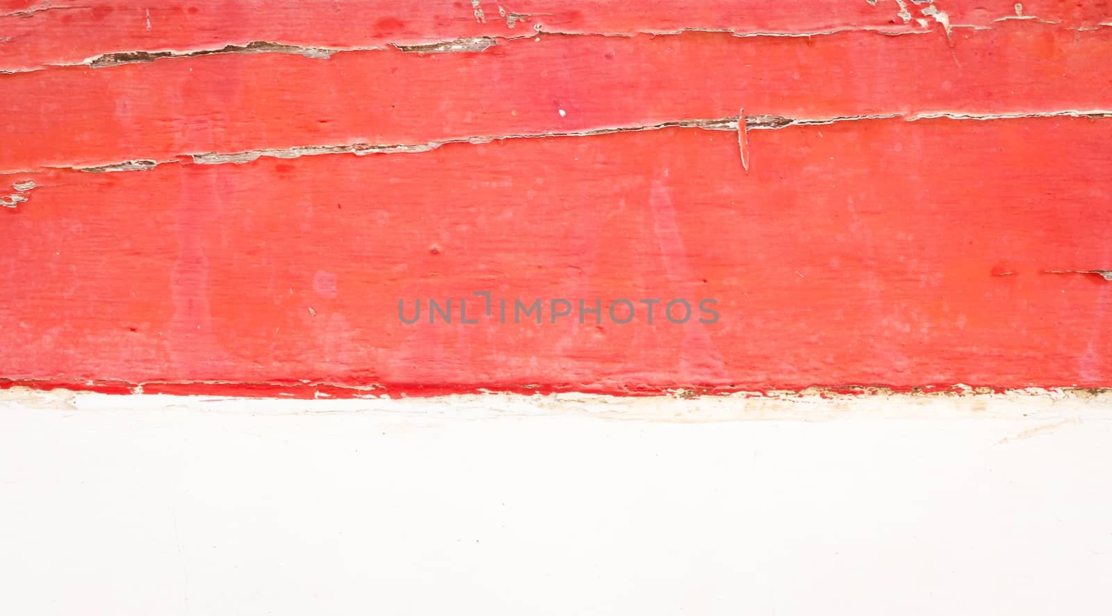 red old wooden wall and white concrete below.