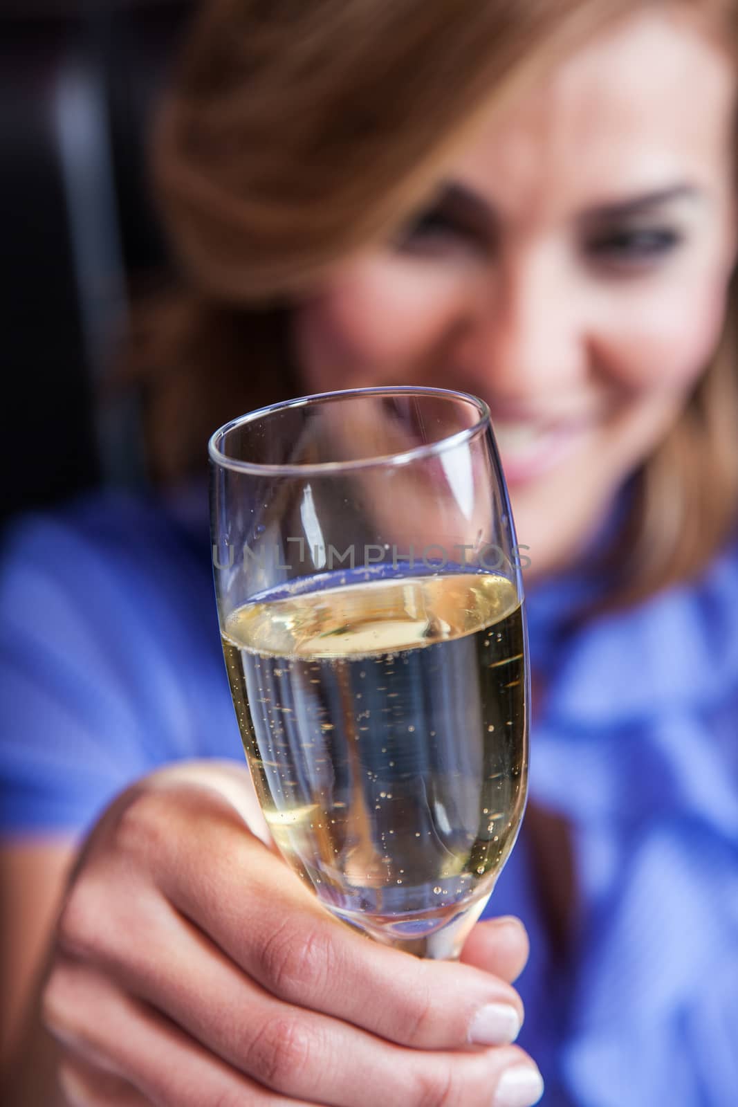 Smiling woman making a toast