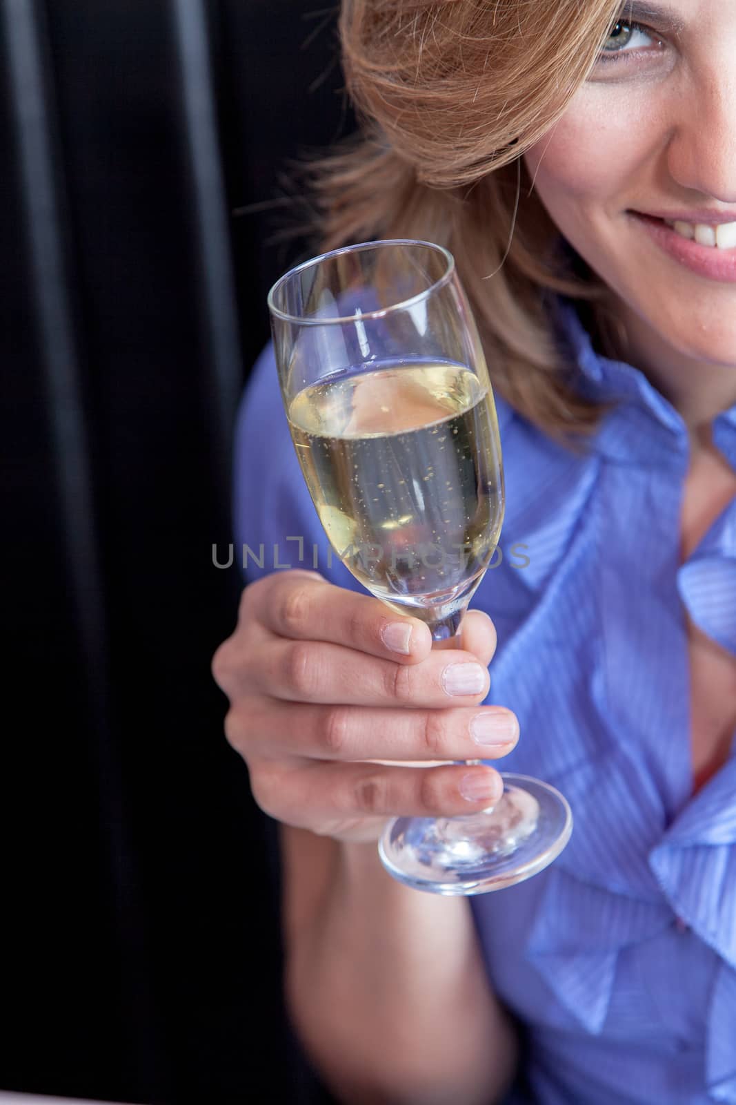 Smiling woman making a toast