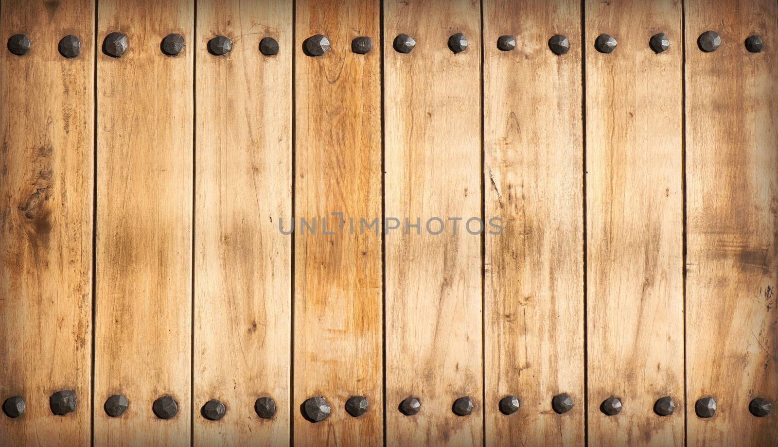 Wood clapboards background with several nails forming a frame