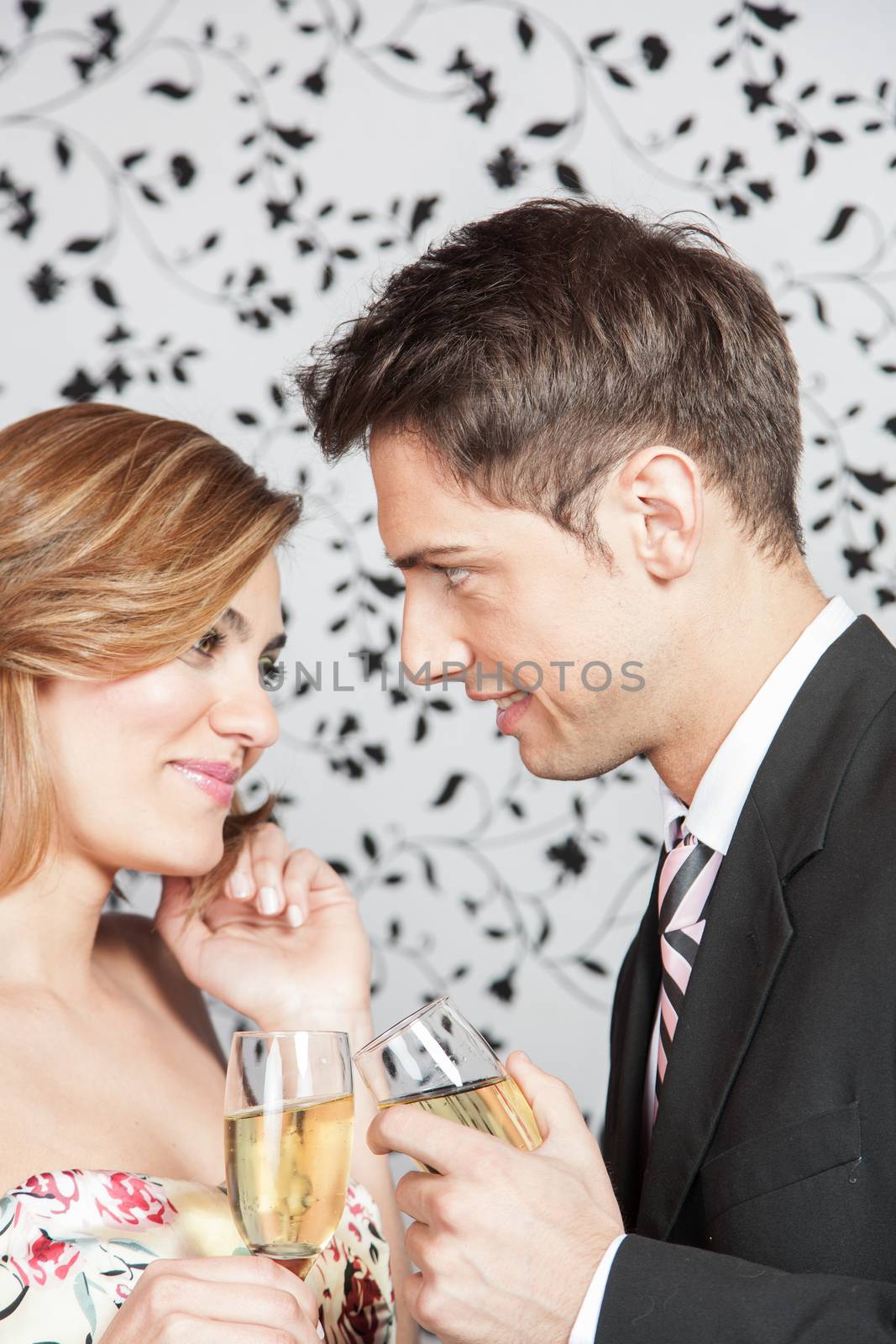 Young couple in love making a toast
