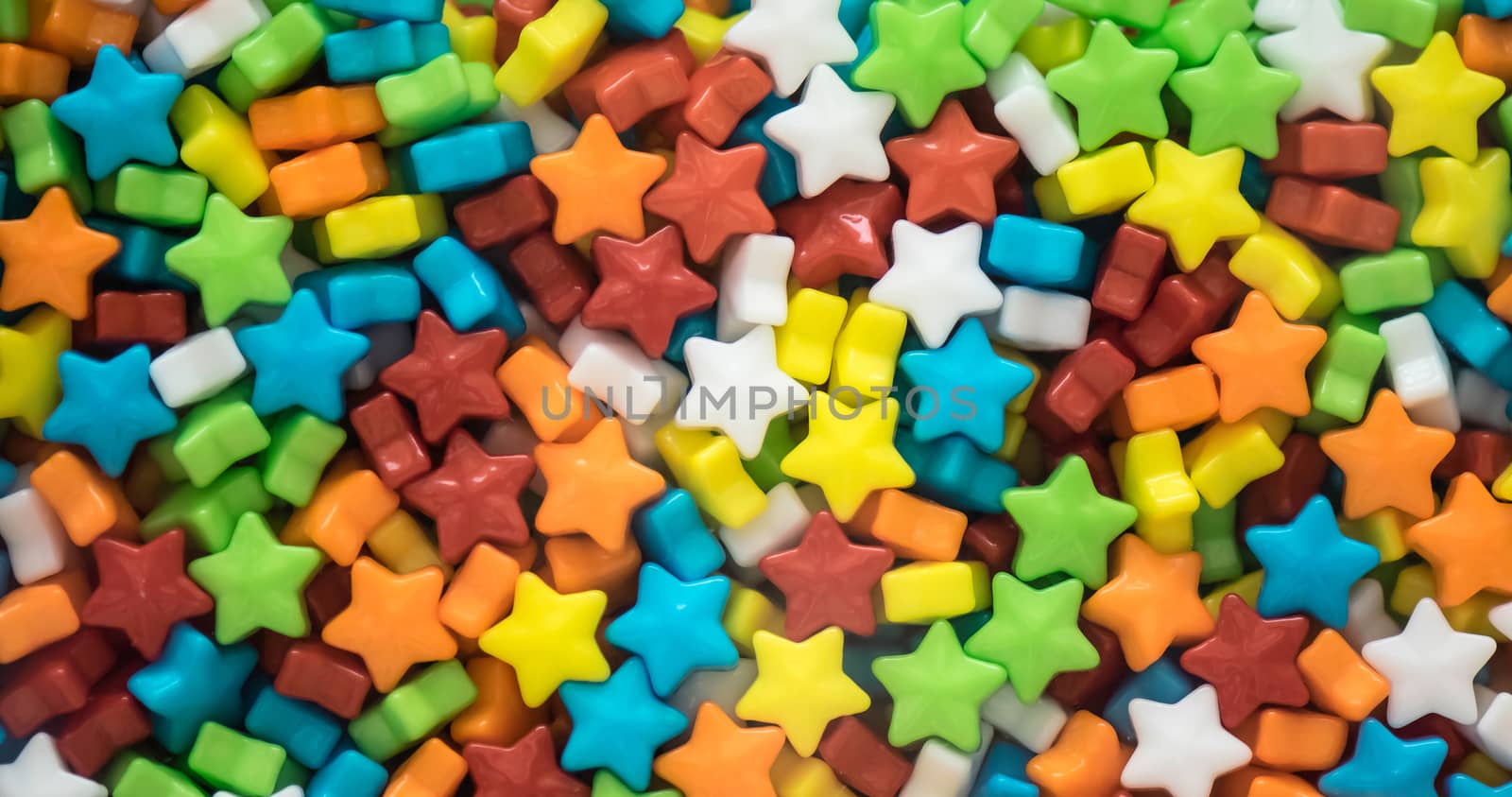 A lot of multicolored little star shape candies