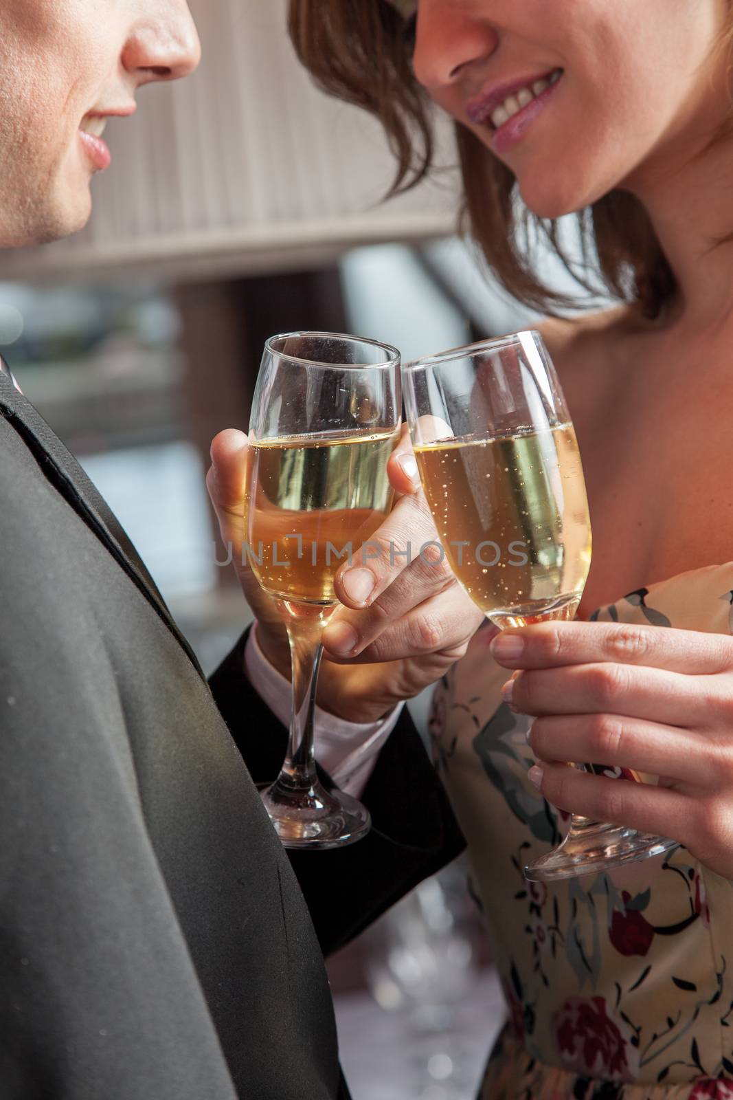 Young couple in love making a toast