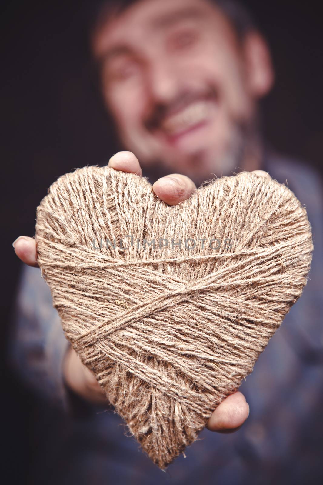 Man holding heart in his hands