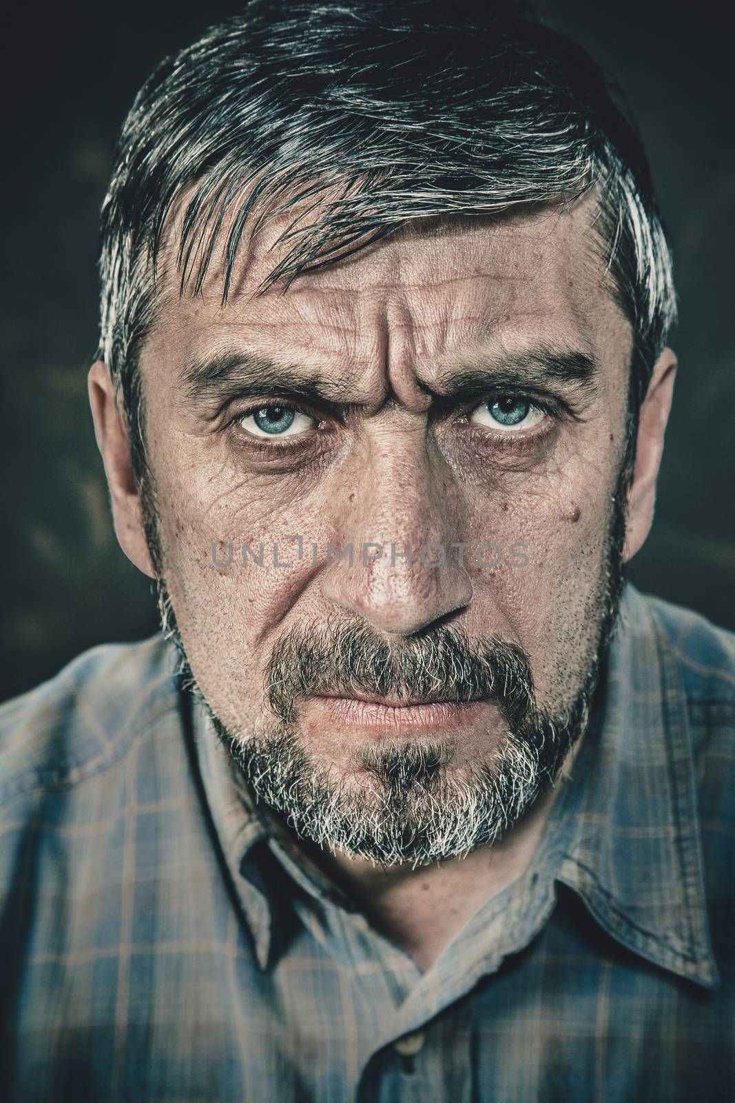 Portrait of a serious man with a beard