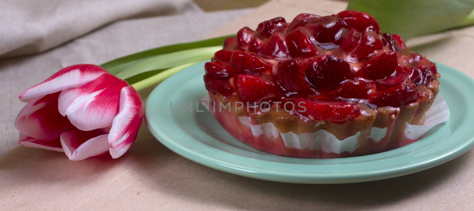 fresh strawberry tart on a plate by victosha
